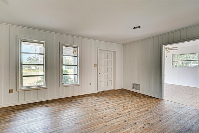 unfurnished room with ceiling fan and light hardwood / wood-style flooring