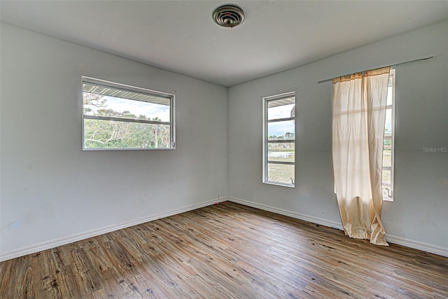 empty room featuring hardwood / wood-style floors