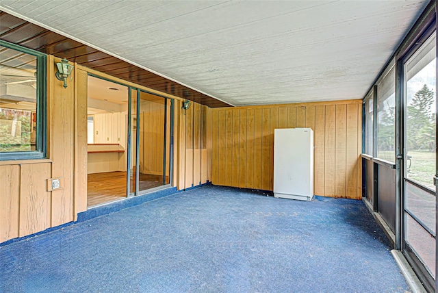 unfurnished sunroom with plenty of natural light