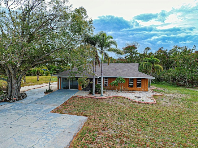 ranch-style home featuring a front yard