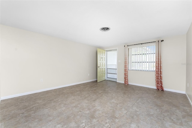 empty room with light tile floors