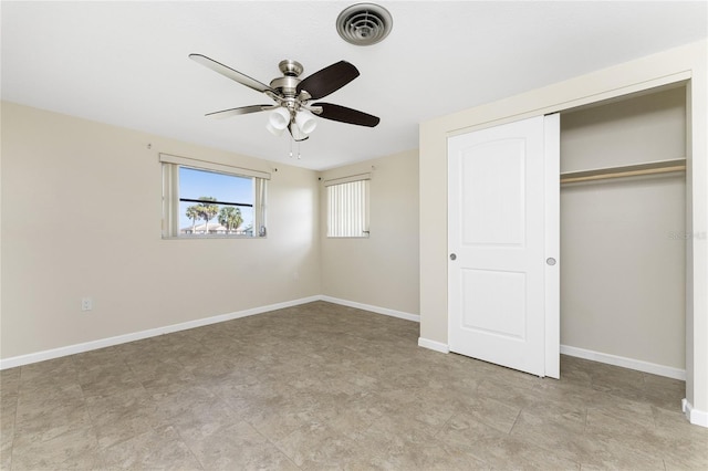 unfurnished bedroom featuring ceiling fan, a closet, and light tile floors