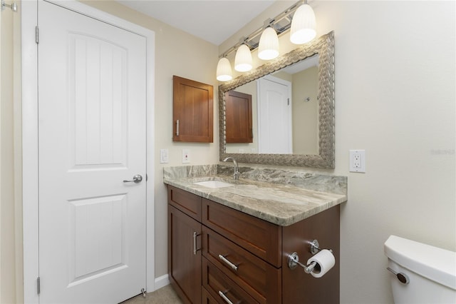 bathroom with oversized vanity and toilet