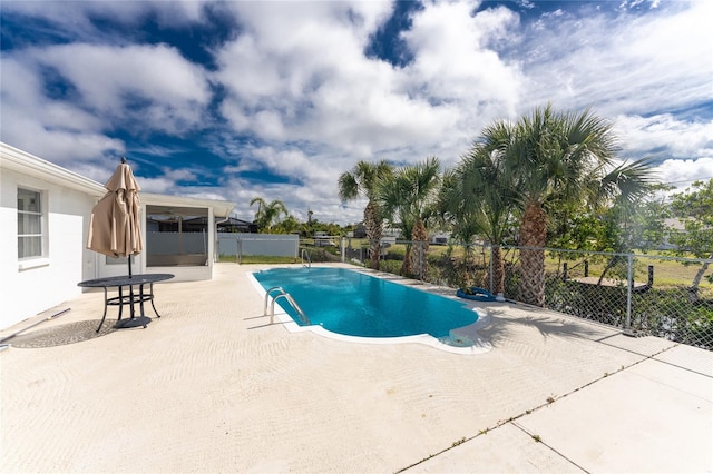 view of pool featuring a patio