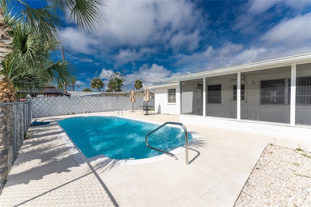 view of swimming pool with a patio area