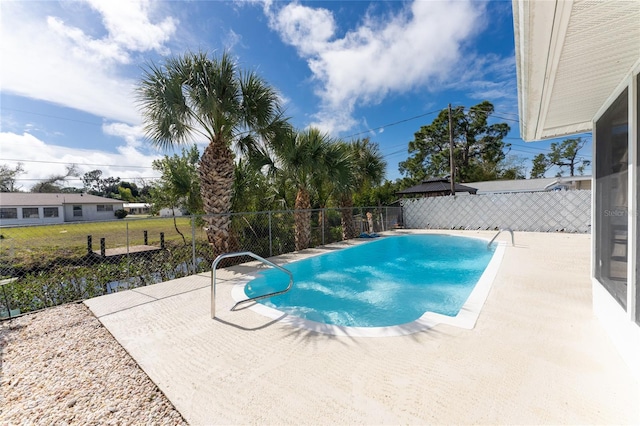 view of swimming pool with a patio