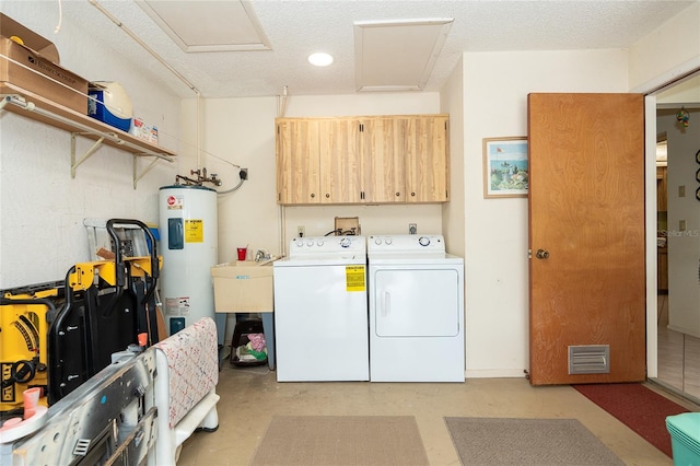 washroom featuring washer hookup, washer and clothes dryer, electric dryer hookup, electric water heater, and cabinets