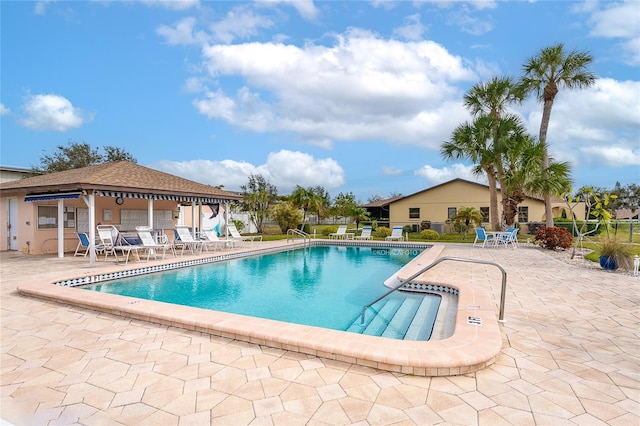 view of swimming pool featuring a patio