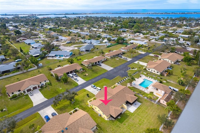 birds eye view of property with a water view