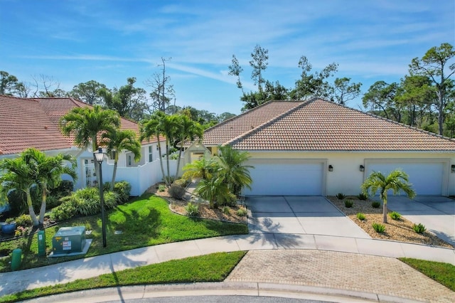 mediterranean / spanish house featuring a garage