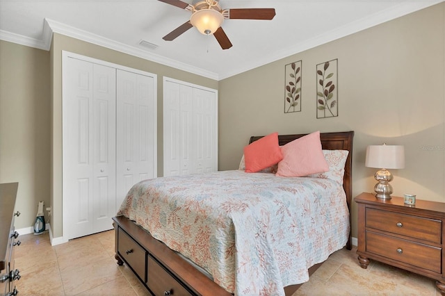 bedroom featuring light tile flooring, multiple closets, ornamental molding, and ceiling fan