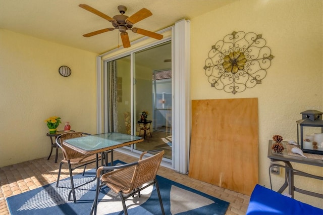 view of patio featuring ceiling fan