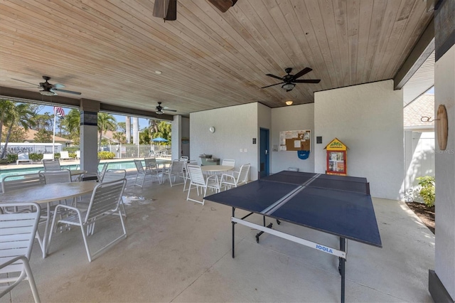 view of patio / terrace featuring a fenced in pool and ceiling fan