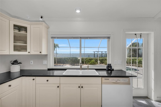 kitchen with white cabinetry, dishwasher, sink, backsplash, and crown molding