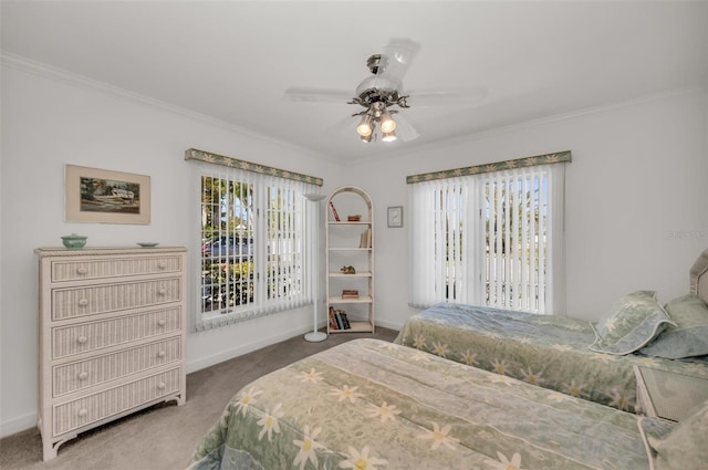 bedroom with ceiling fan, carpet floors, and ornamental molding