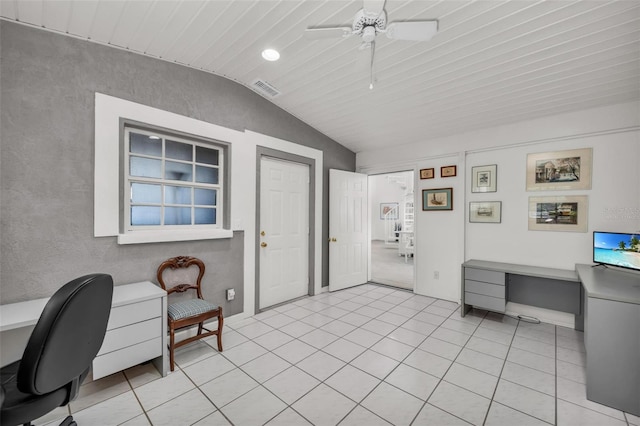 office space featuring ceiling fan, light tile patterned flooring, and lofted ceiling