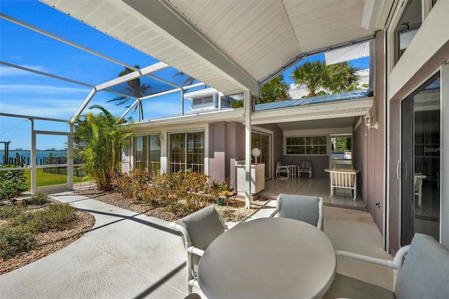 view of patio / terrace featuring glass enclosure