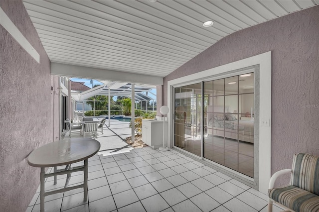 sunroom / solarium with wooden ceiling and lofted ceiling