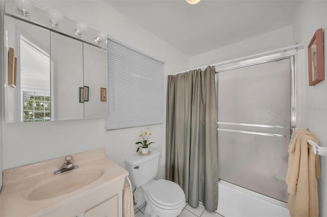 full bathroom featuring tile patterned flooring, vanity, toilet, and enclosed tub / shower combo