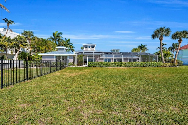 view of yard featuring glass enclosure