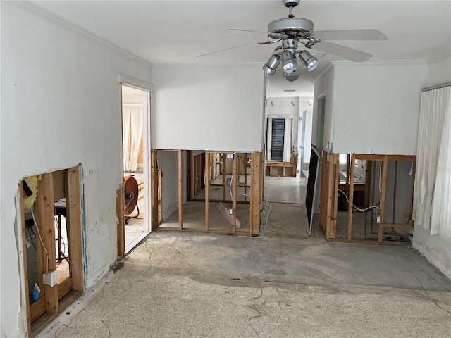 misc room with ceiling fan and crown molding