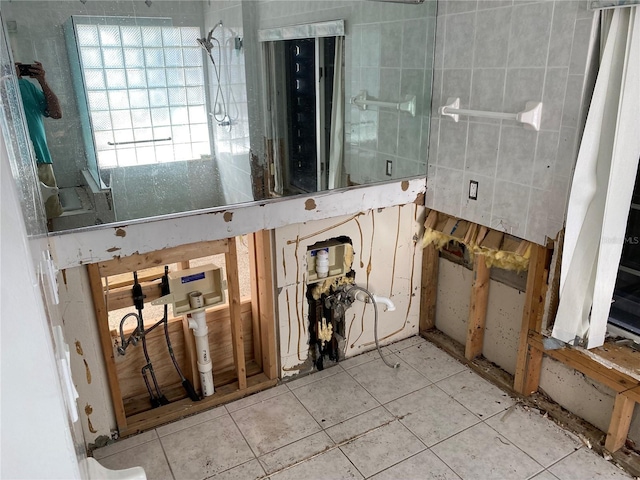 bathroom with tile patterned floors