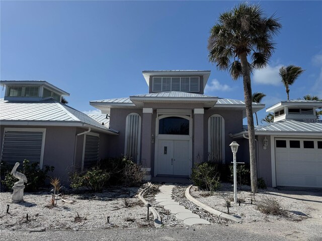 view of front of home with a garage