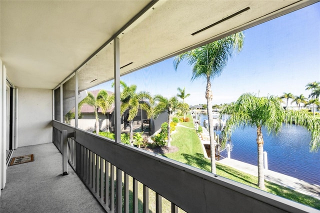 balcony featuring a water view