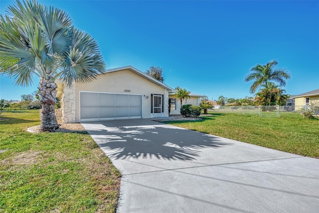 single story home featuring a front lawn and a garage