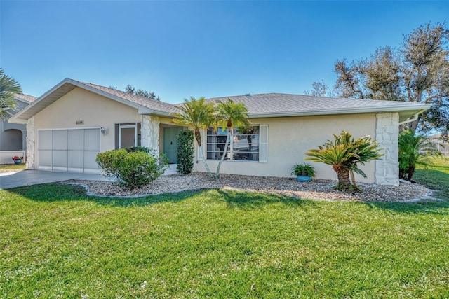 ranch-style home featuring a front lawn and a garage