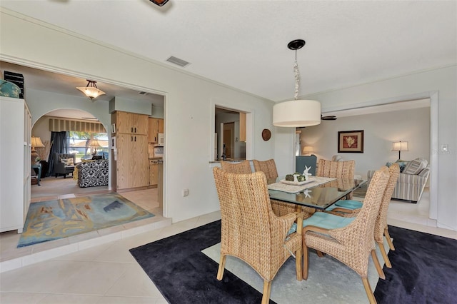 dining space with light tile floors