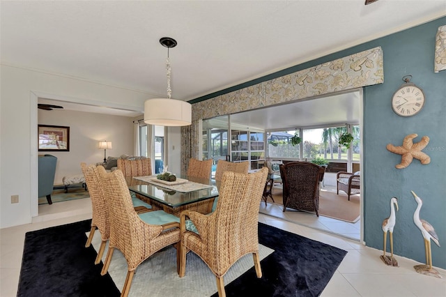 dining area featuring light tile flooring