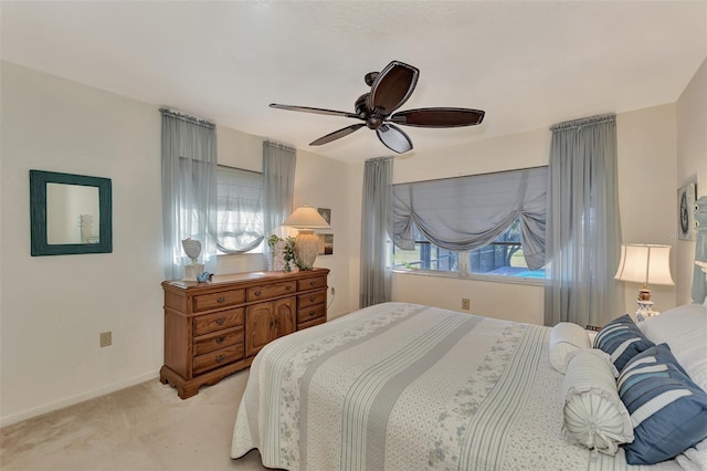 bedroom with light colored carpet and ceiling fan