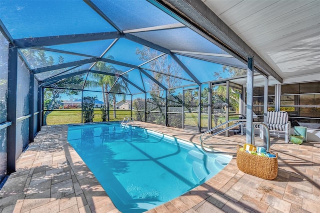 view of pool featuring a lanai and a patio