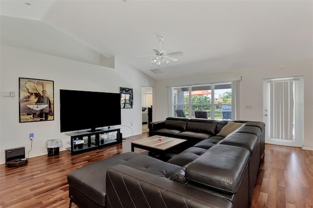 living room featuring ceiling fan, wood-type flooring, and vaulted ceiling