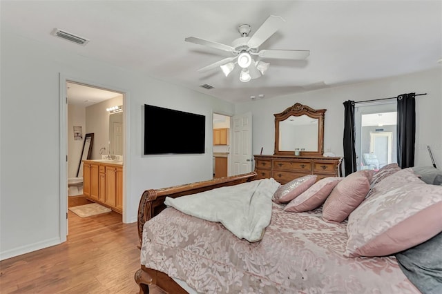 bedroom with connected bathroom, light hardwood / wood-style floors, and ceiling fan