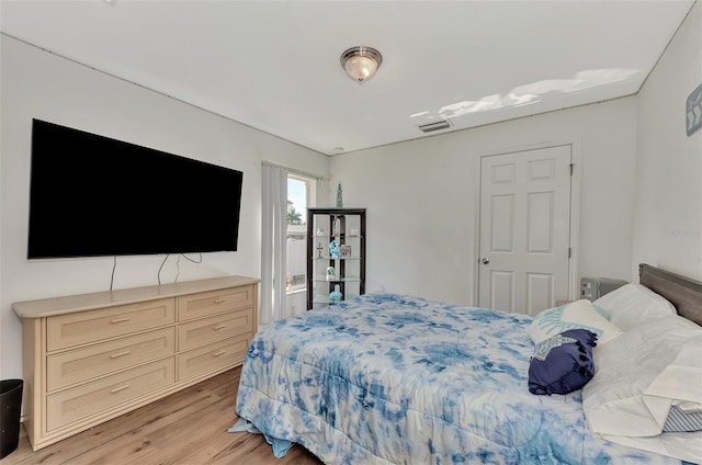 bedroom with light wood-type flooring