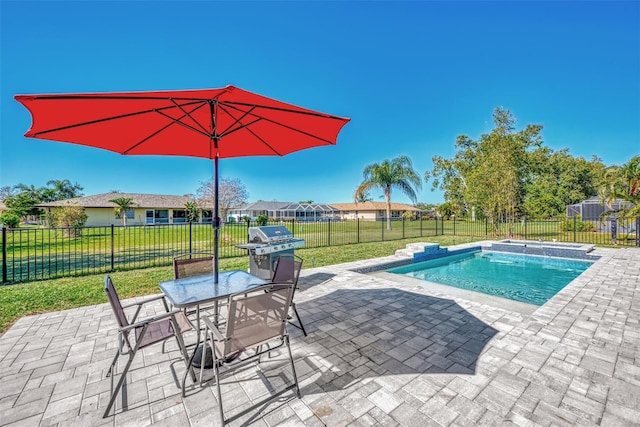 view of pool with a yard and a patio area