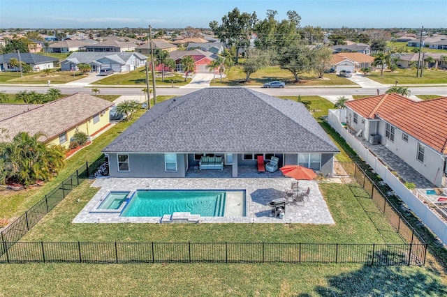 view of pool featuring a patio area and a yard