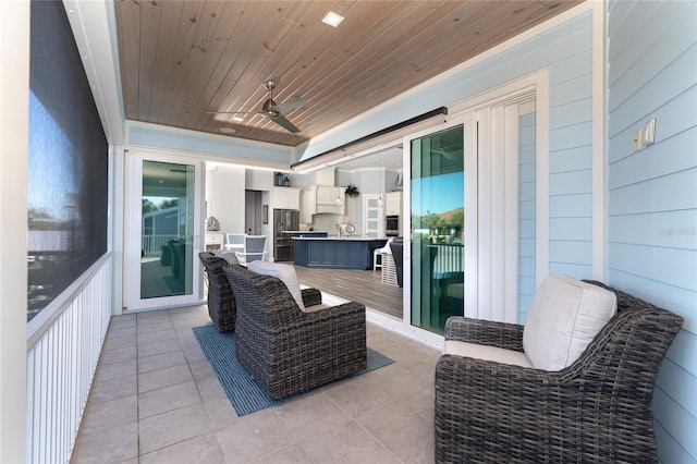 view of patio featuring ceiling fan