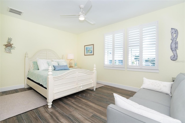 bedroom with dark wood-type flooring and ceiling fan