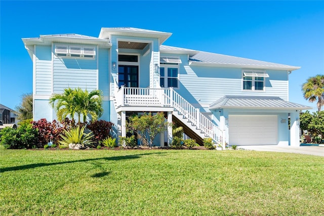 beach home with a garage and a front yard