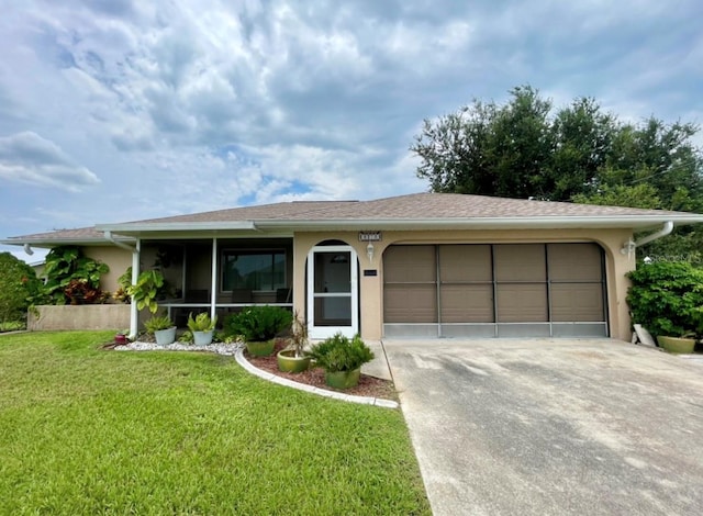 ranch-style house with a garage and a front lawn