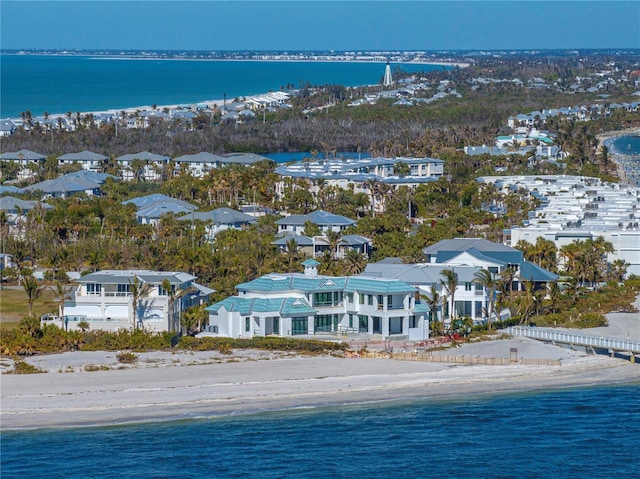 drone / aerial view featuring a view of the beach and a water view