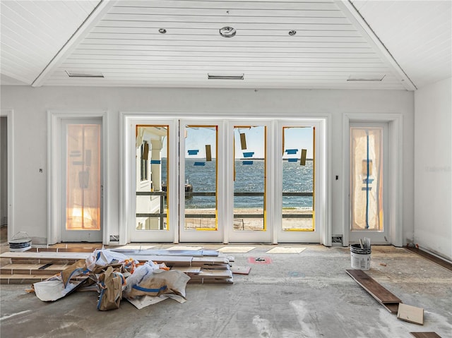 interior space featuring lofted ceiling with beams