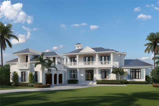 view of front of home featuring a balcony, a front yard, and french doors