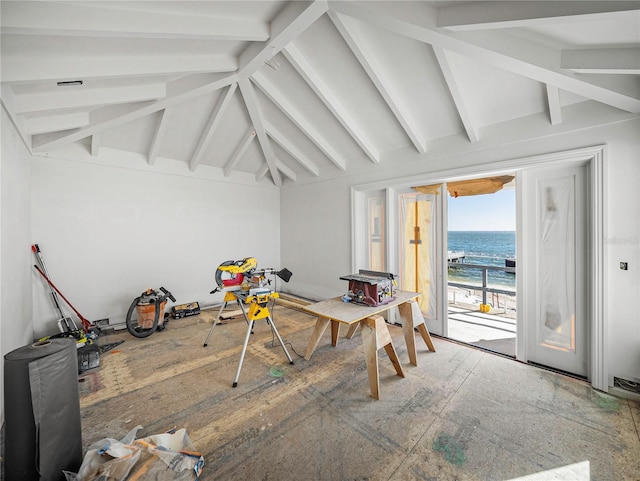 interior space with beamed ceiling and a water view