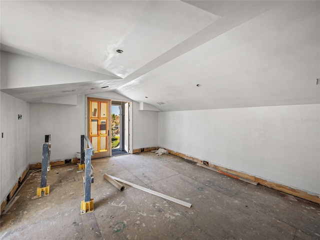 additional living space featuring vaulted ceiling