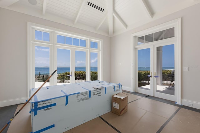 894 Hill Tide Ln, Boca Grande, FL 33921 - unfurnished sunroom featuring french doors, a water view, and healthy amount of natural light