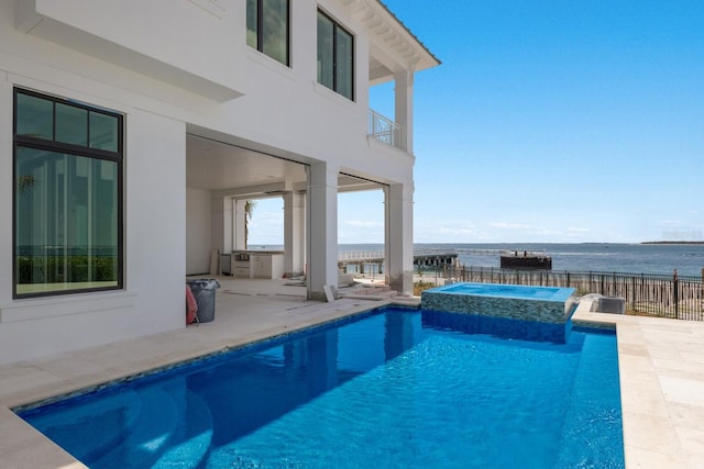 894 Hill Tide Ln, Boca Grande, FL 33921 - view of swimming pool featuring a patio, a water view, and a pool with connected hot tub